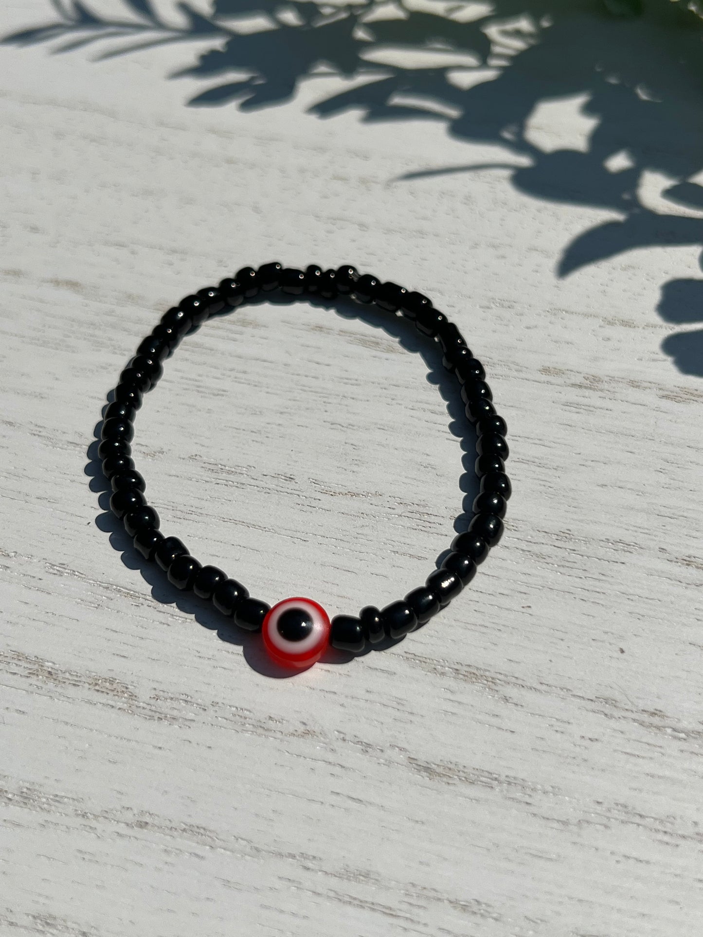 Black Bead Red OJO