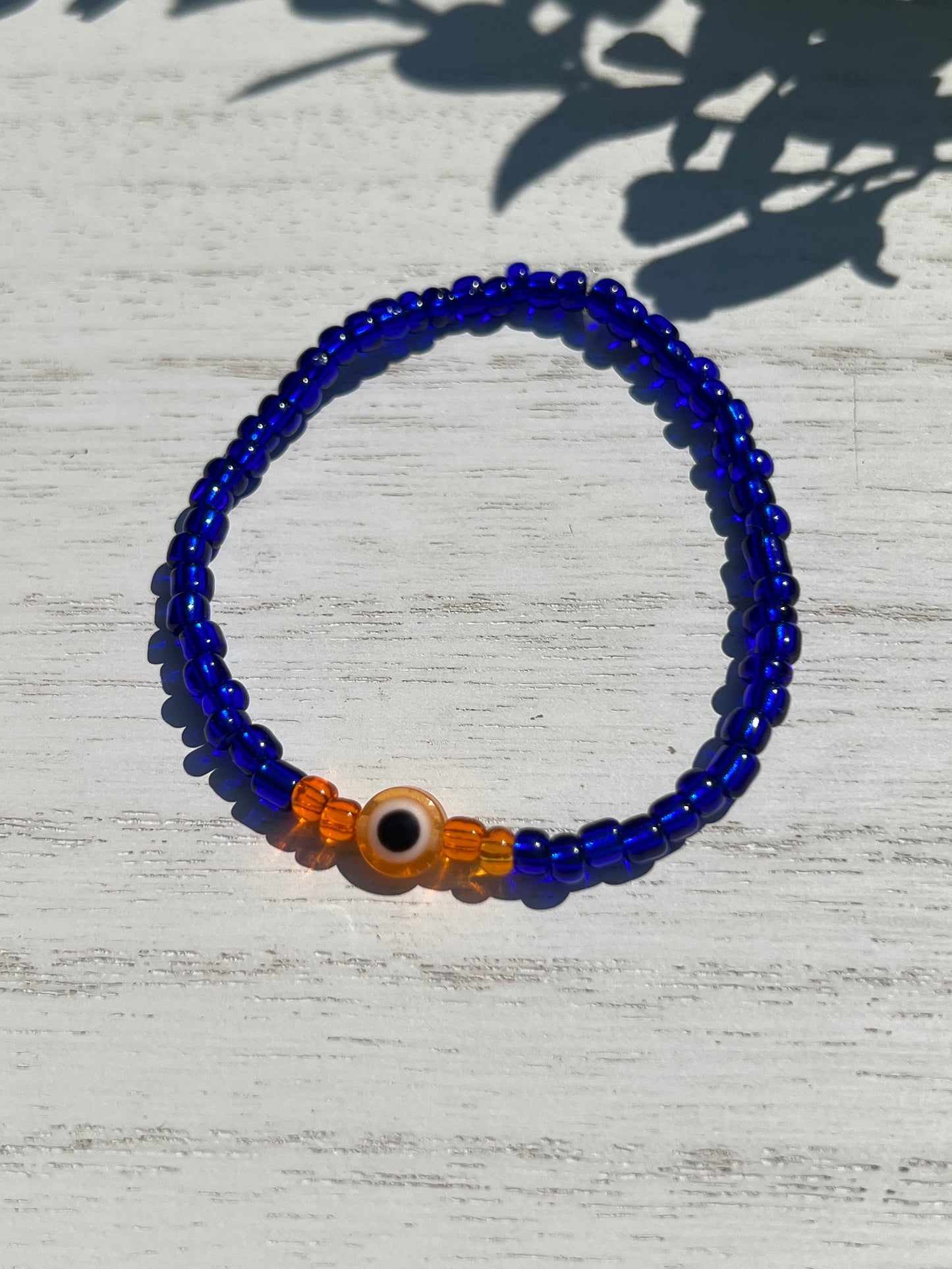 Blue Bead Orange OJO