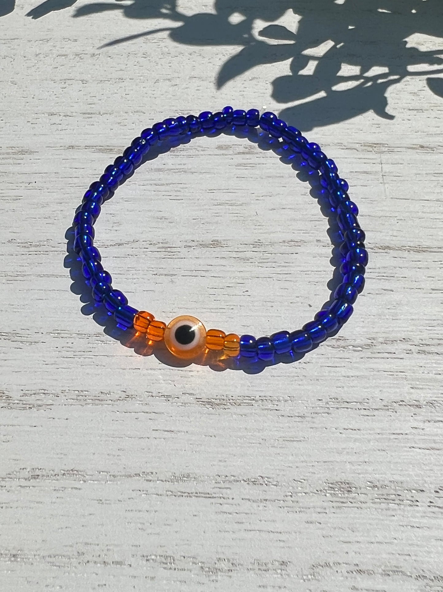 Blue Bead Orange OJO